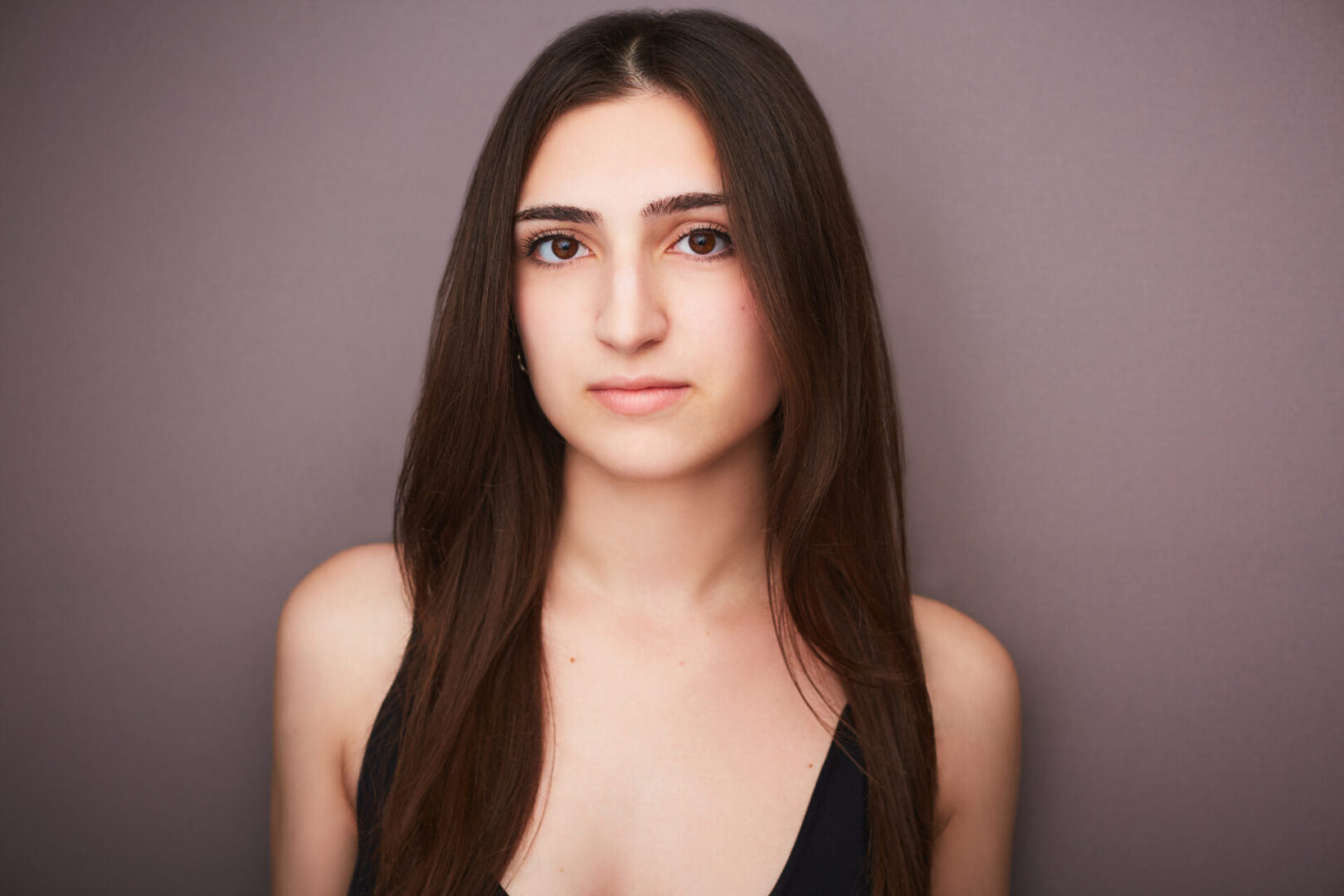 Young woman with long brown hair.