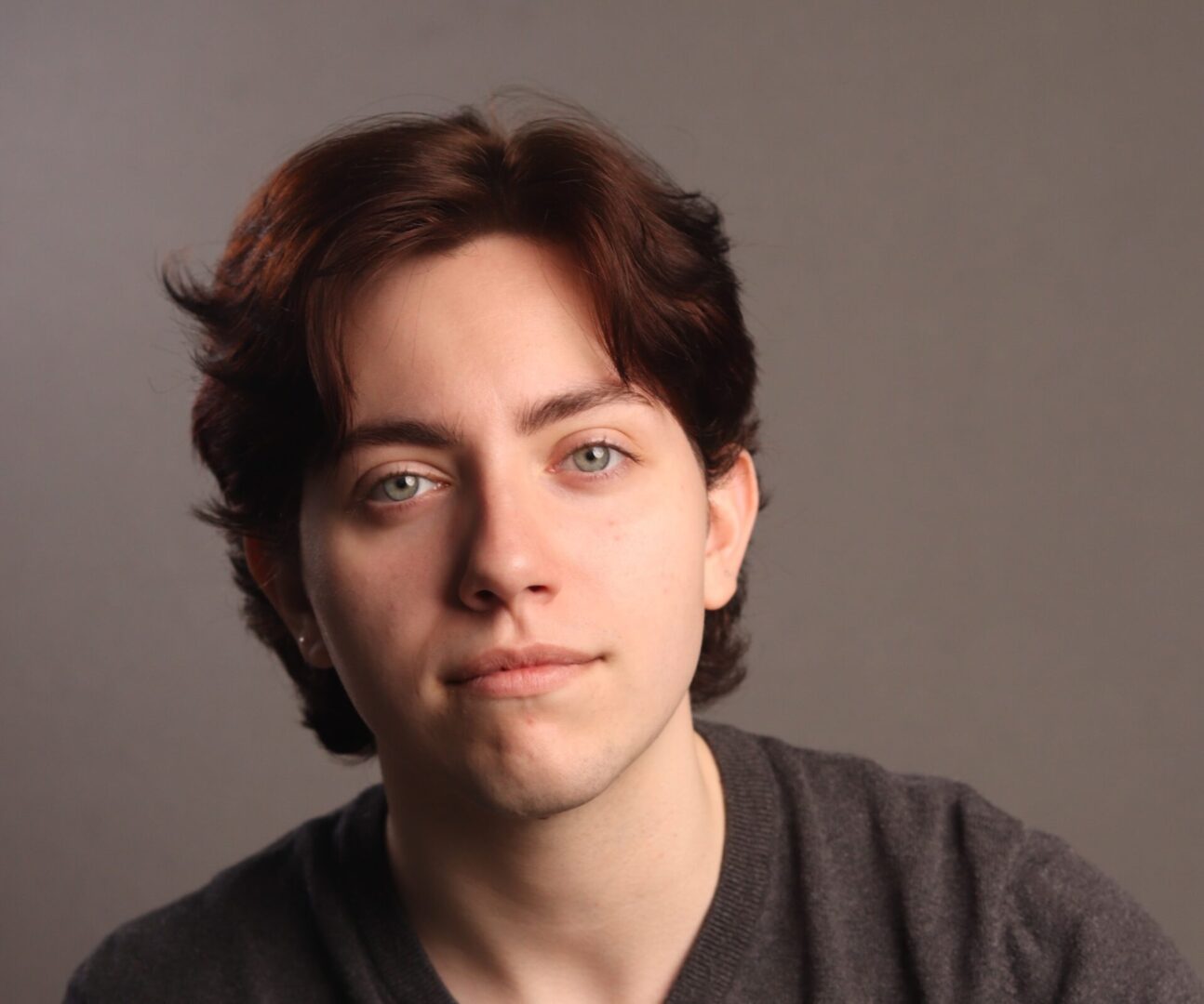 Portrait of a young person with brown hair.