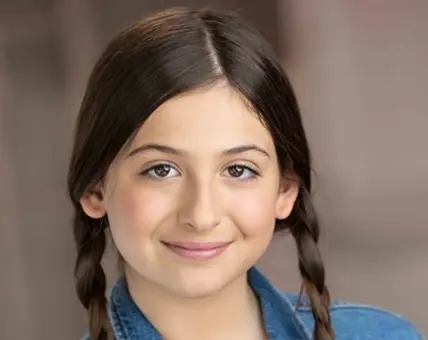 Smiling girl with braided hair.