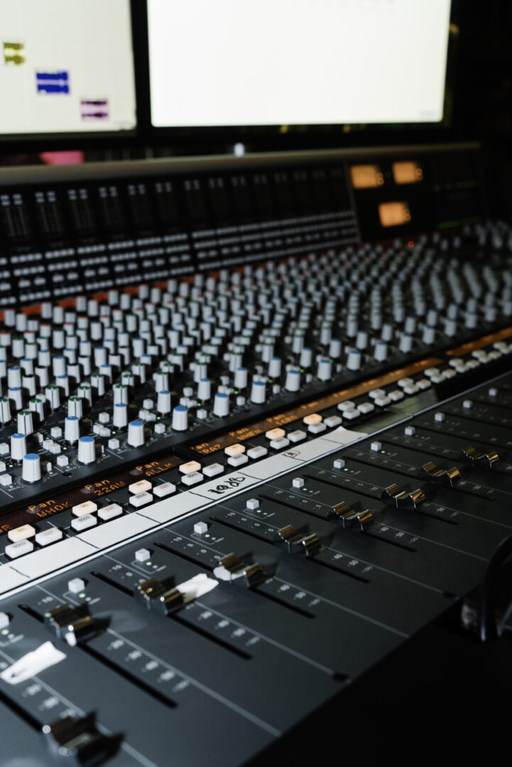 Large mixing console in recording studio.